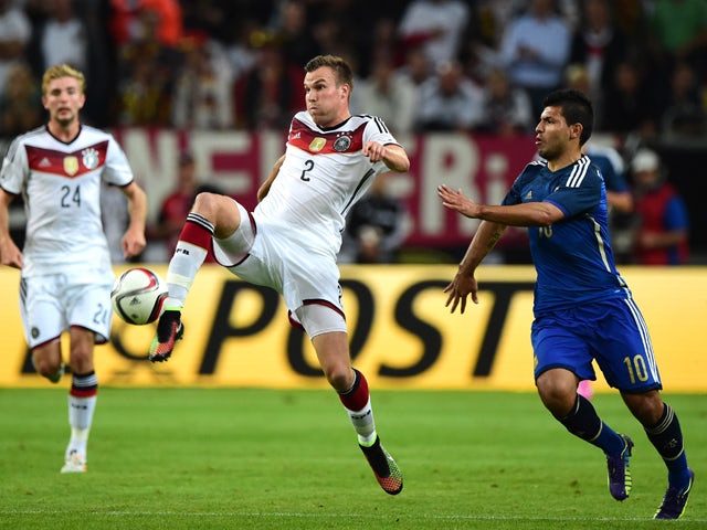 Argentina's striker Sergio Aguero vies with Germany's defender Kevin Grosskreutz during a friendly football match between Germany vs Argentina in Duesseldorf, Germany, on September 3, 2014