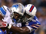 George Winn #38 of the Detroit Lions is taken down by Jacquies Smith #54 of the Buffalo Bills during the second half of a preseason game at Ralph Wilson Stadium on August 28, 2014