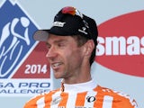 Jens Voigt of Germany riding for Trek Factory Racing celebrates on the podium in the orange most courageous rider jersey after the final stage of the 2014 USA Pro Challenge on August 24, 2014