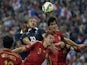 French forward Karim Benzema (C) vies with Spanish defender Mikel San Jose (R) during the friendly football match France vs Spain, on September 4, 2014 