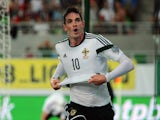 Northern Ireland's forward Kyle Lafferty (C) celebrates scoring against Hungary during a qualification match for EURO 2016 between Hungary and Northern Ireland on September 7, 2014 