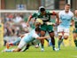 Manu Tuilagi of Leicester is tackled by Adam Powell (L) and Josh Furno (R) of Newcastle during the Aviva Premiership match on September 6, 2014