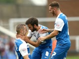 Marcus Maddison of Peterborough celebrates with Jack Payne and Jon Taylor after he scores to make it 1-0 during the Sky Bet League One match against Port Vale on September 6, 2014