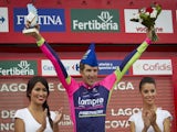 Lampre's Polish cyclist Przemyslaw Niemiec (C) celebrates his victory on the podium of the 15th stage of the 69th edition of 'La Vuelta' Tour of Spain, a 152,2 km ride on September 7, 2014