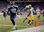 Fullback Derrick Coleman #40 of the Seattle Seahawks scores a touchdown as cornerback Tramon Williams #38 of the Green Bay Packers gives chase during the fourth quarter of the game at CenturyLink Field on September 4, 2014