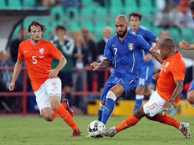 Simone Zaza (C) of Italy competes for the ball with Nigel De Jong of Netherlands during the international friendly match on September 4, 2014