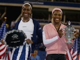 Venus & Serena Williams pose with their trophy after the finals at the US Open September 7, 2002