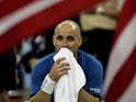 Andre Agassi sits in his chair after losing the men's final to Roger Federer of Switzerland in the US Open at the USTA National Tennis Center in Flushing Meadows Corona Park on September 11, 2005 