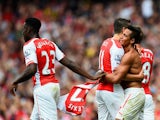 Alexis Sanchez of Arsenal celebrates scoring their second goal with Mesut Oezil and Danny Welbeck of Arsenal during the Barclays Premier League match between Arsenal and Manchester City at Emirates Stadium on September 13, 2014