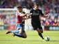 Lukas Jutkiewicz of Burnley is challenged by Scott Dann of Crystal Palace during the Barclays Premier League match between Crystal Palace and Burnley at Selhurst Park on September 13, 2014