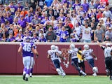 Chandler Jones #95 of the New England Patriots blocks and returns a field goal attempt by the Minnesota Vikings for a touchdown at TCF Bank Stadium on September 14, 2014