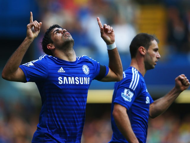 Diego Costa of Chelsea celebrates alongside Branislav Ivanovic as he scores their second goal during the Barclays Premier League match between Chelsea and Swansea City at Stamford Bridge on September 13, 2014