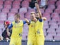 Chievo's Argentinian forward Maxi Lopez celebrates with teammates after scoring during the Italian Serie A football match SSC Napoli vs AC Chievo Verona in San Paolo Stadium on September 14, 2014