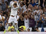 Real Madrid's Portuguese forward Cristiano Ronaldo celebrates after scoring during the Spanish league football match Real Madrid CF vs Club Atletico de Madrid on September 13, 2014