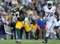 Wide receiver Davante Adams #17 of the Green Bay Packers runs with the football after receiving a 24 yard pass ahead of defensive tackle Leger Douzable on September 14, 2014