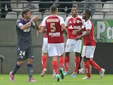 Reims' French forward David N'Gog (2nd R) celebrates with teammates after scoring during the French Ligue 1 football match between Reims and Toulouse, on September 13, 2014