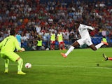 Danny Welbeck of England shoots past goalkeeper Yann Sommer of Switzerland to score their first goal during the UEFA EURO 2016 Group E qualifying match between Switzerland and England at St Jakob-Park on September 8, 2014