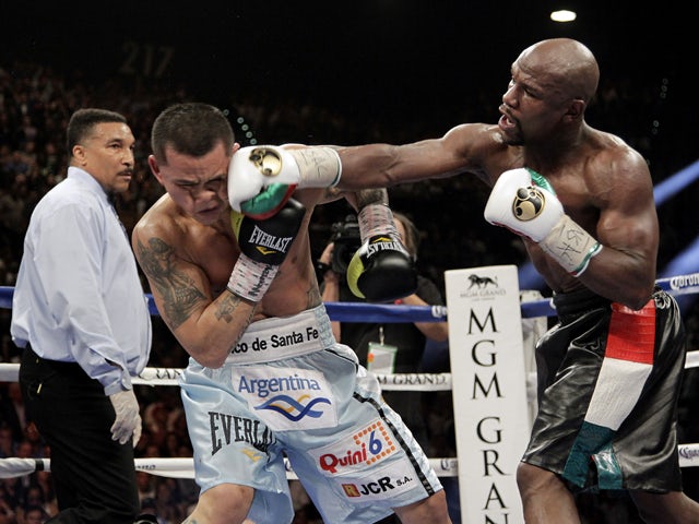 Floyd Mayweather Jr of US slams a right to the face of Marcos Maidana from Argentina on May 3, 2014