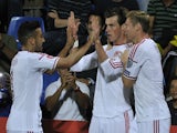 Wales forward Gareth Bale (C) celebrates with teammates forward Simon Church (R) and defender Lewin Nyatanga after scoring a goal during the Euro 2016 qualifying round match against Andorra on September 9, 2014