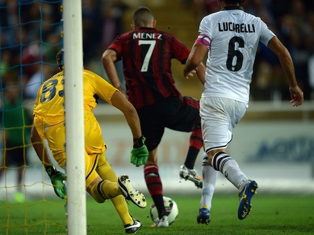 AC Milan's French forward Jeremy Menez (C) scores during the Serie A football match Parma vs AC Milan at Parma's Ennio Tardini Stadium on September 14, 2014