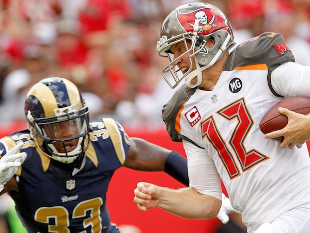 Josh McCown #12 of the Tampa Bay Buccaneers rushes for a touchdown as E.J. Gaines #33 of the St. Louis Rams defends during a game on September 14, 2014