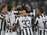 Juventus' players celebrate after scoring during the Italian Serie A football match between Juventus and Udinese on September 13, 2014