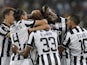 Juventus' players celebrate after scoring during the Italian Serie A football match between Juventus and Udinese on September 13, 2014