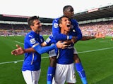 Leonardo Ulloa of Leicester City celebrates scoring the first goal with David Nugent and Jeffrey Schlupp of Leicester City during the Barclays Premier League match between Stoke City and Leicester City at Britannia Stadium on September 13, 2014