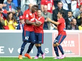 Lille's Belgian forward Divock Origi is congratulated by teammates after scoring a goal during the French L1 football match Lille (LOSC) vs Nantes (FCN) on September 14, 2014
