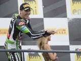 Loris Baz of France and Kawasaki Racing Team celebrates the third place on the podium at the end of the race 1 during the FIM Superbike World Championship - Race at Portimao Circuit on July 6, 2014