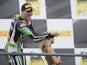 Loris Baz of France and Kawasaki Racing Team celebrates the third place on the podium at the end of the race 1 during the FIM Superbike World Championship - Race at Portimao Circuit on July 6, 2014