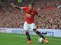 Manchester United's Argentinian defender Marcos Rojo crosses the ball during the English Premier League football match between Manchester United and Queens Park Rangers at Old Trafford in Manchester, north west England on September 14, 2014