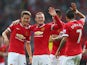Wayne Rooney of Manchester United celebrates scoring the third goal with team-mates Ander Herrera (L), Marcos Rojo and Angel Di Maria during the Barclays Premier League match between Manchester United and Queens Park Rangers at Old Trafford on September 1