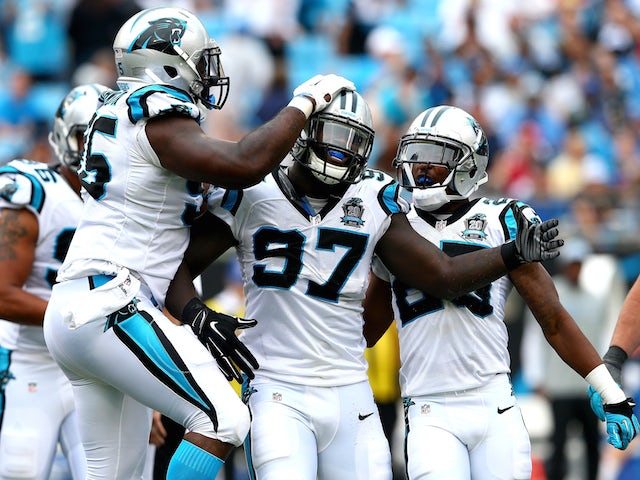 Mario Addison #97 of the Carolina Panthers celebrates with teammates after a sack against the Detroit Lions on September 14, 2014