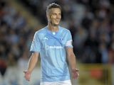 Malmo's Markus Rosenberg reacts after his double score in the UEFA Champions League play-off second leg soccer match against FC Red Bull Salzburg on August 27, 2014