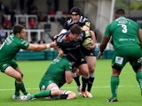 Falcons player Adam Powell is stopped by Irish players Fergus Mulchrone and captain George Skivington during the Aviva Premiership match between Newcastle Falcons and London Irish at Kingston Park on September 14, 2014