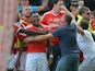 Britt Assombalonga of Forest celebrates scoring to make it 1-0 dwith team mates and fans during the Sky Bet Championship match between Nottingham Forest and Derby County at the City Ground on September 14, 2014