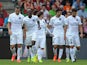 Paris' French defender Zoumana Camara celebrates with his teammates after scoring during the French L1 football match between Rennes (SRFC) and Paris Saint-Germain (PSG) on September 13, 2014