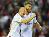 Philippe Senderos (L) of Aston Villa celebrates victory with Nathan Baker after the Barclays Premier League match against Liverpool on September 13, 2014