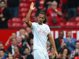 Rio Ferdinand of QPR salutes the crowd at the end of the Barclays Premier League match between Manchester United and Queens Park Rangers at Old Trafford on September 14, 2014