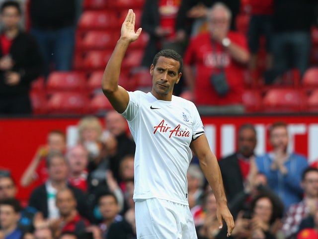 Rio Ferdinand of QPR salutes the crowd at the end of the Barclays Premier League match between Manchester United and Queens Park Rangers at Old Trafford on September 14, 2014