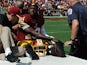 Quarterback Robert Griffin III #10 of the Washington Redskins is carted off the field after being injured during a game against the Jacksonville Jaguars on September 14, 2014