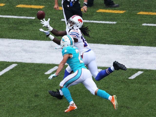 Sammy Watkins #14 of the Buffalo Bills attempts a catch as Brent Grimes #21 of the Miami Dolphins defends during the first half at Ralph Wilson Stadium on September 14, 2014