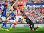Ben Hamer of Leicester City makes a save from Peter Crouch of Stoke City during the Barclays Premier League match between Stoke City and Leicester City at Britannia Stadium on September 13, 2014 