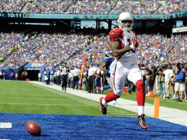 Wide receiver Ted Ginn #19 of the Arizona Cardinals celebrates a touchdown after running back a punt against the New York Giants on September 14, 2014