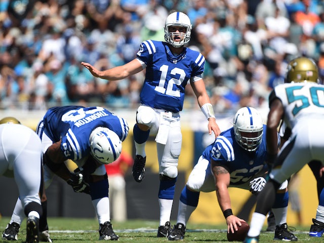 Andrew Luck #12 of the Indianapolis Colts calls a play against the Jacksonville Jaguars at EverBank Field on September 21, 2014 