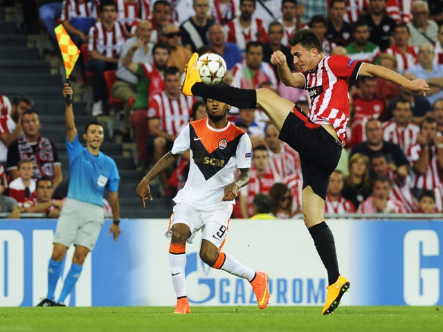 Shakhtar Donetsk's Brazilian forward Luiz Adriano vies with Athletic Bilbao's French defender Aymeric Laporte during the UEFA Champions League football match Athletic Club Bilbao vs FC Shakhtar Donetsk at the San Mames stadium in Bilbao on September 17, 2