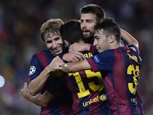 Pique guides Barcelona to win in opener