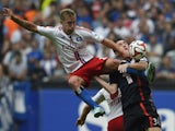 Hamburg's midfielder Lewis Holtby and Bayern Munich's Danish midfielder Pierre Hojbjerg vie for the ball during the German first division Bundesliga football match Hamburger SV vs FC Bayern Munich at the Imtech Arena in Hamburg, northern Germany on Septem
