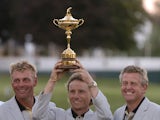 Captain Bernhart Lange, with Darren Clarke and Colin Montgomerie, holds the trophy as the European team celebrates 2004 Ryder Cup award ceremonies in Detroit, Michigan, September 19, 2004
